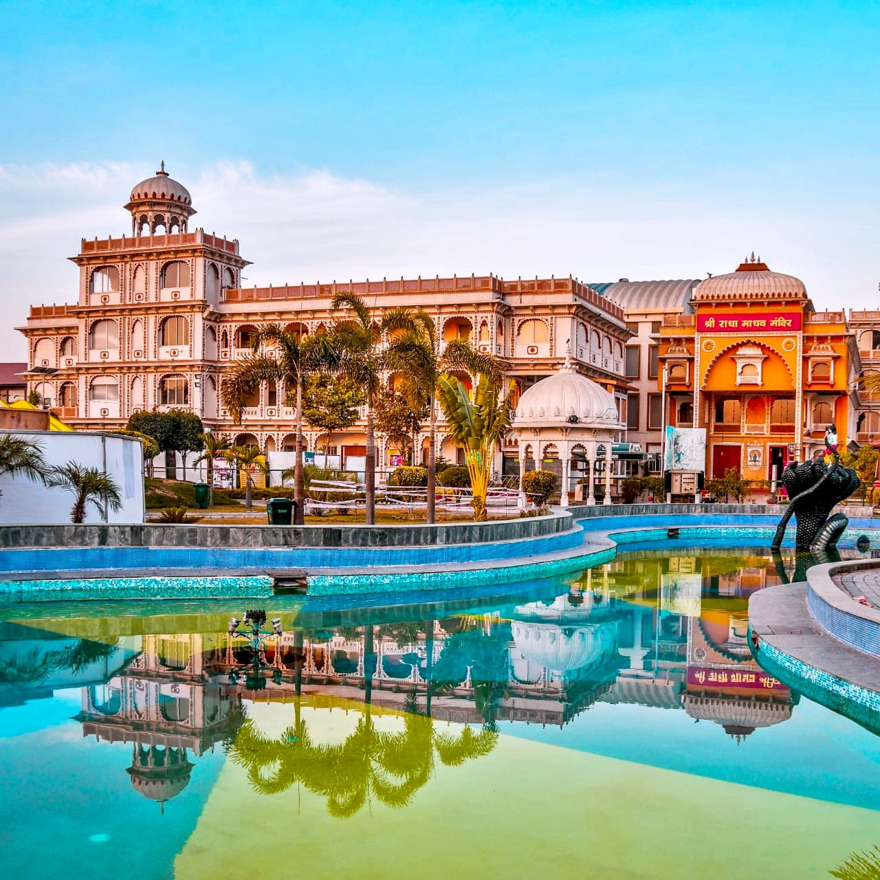 Sri Radha Madhav Mandir, reflected in the pool on the campus